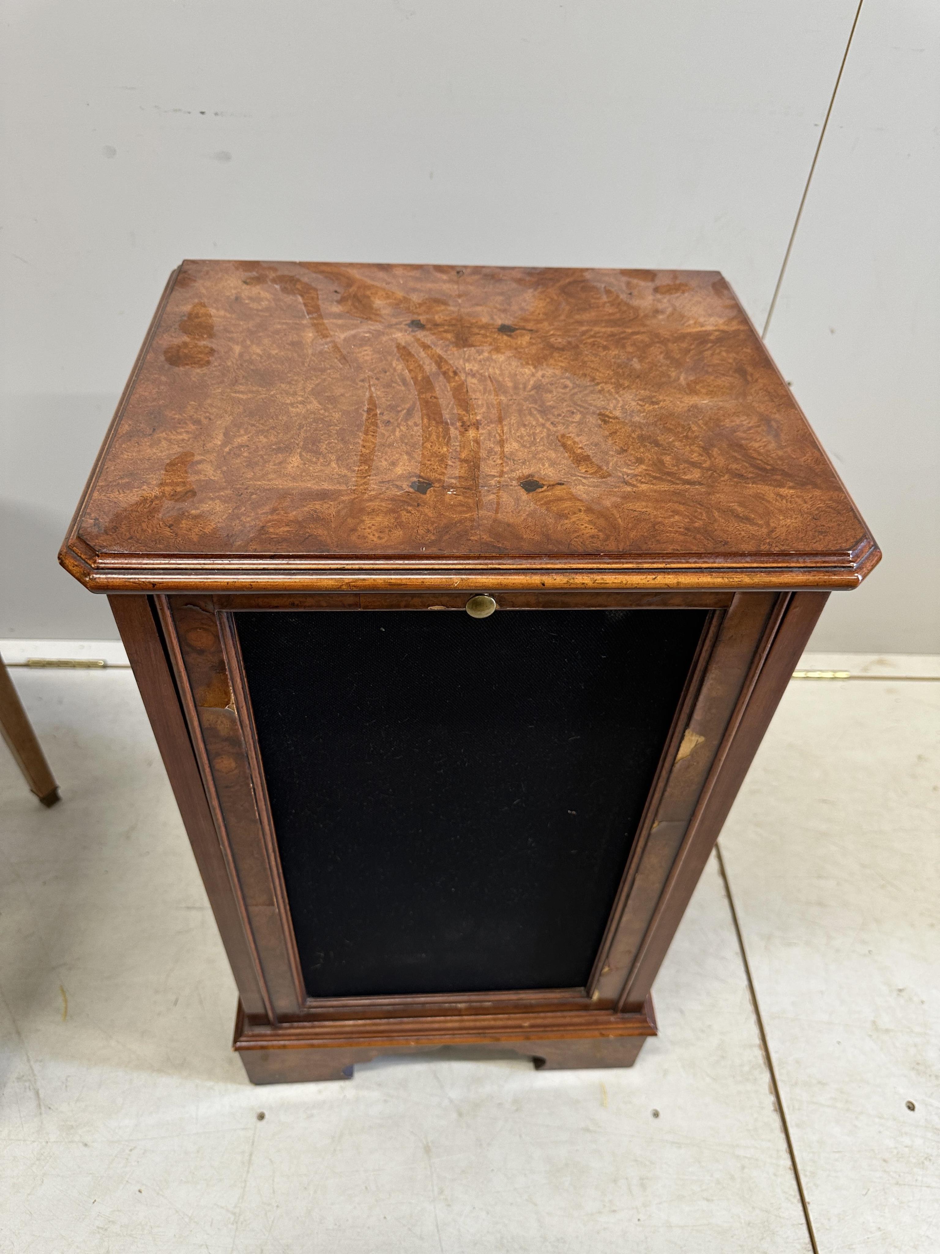 A French Transitional style circular marquetry inlaid coffee table, diameter 59cm, height 46cm together with a walnut speaker cabinet